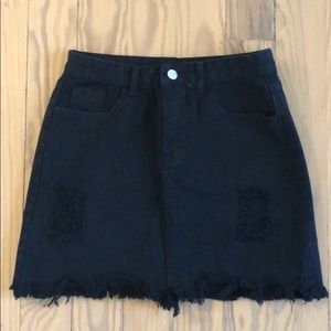 High waisted, distressed black skirt